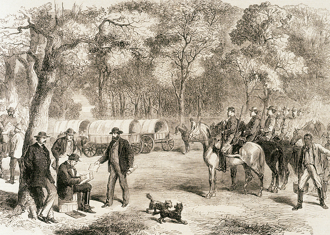 Jefferson Davis signs government papers by the roadside.
