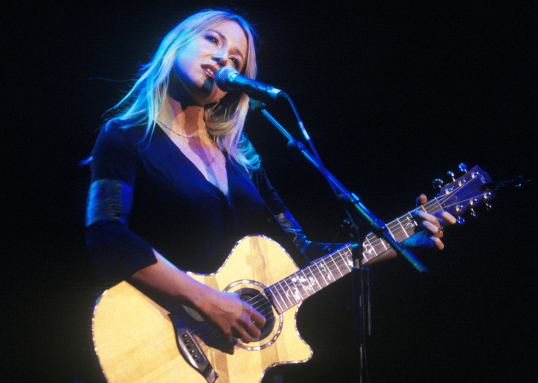 Jewel performs onstage.