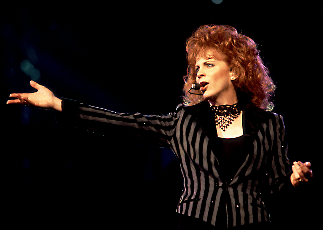 Reba McEntire performing onstage.