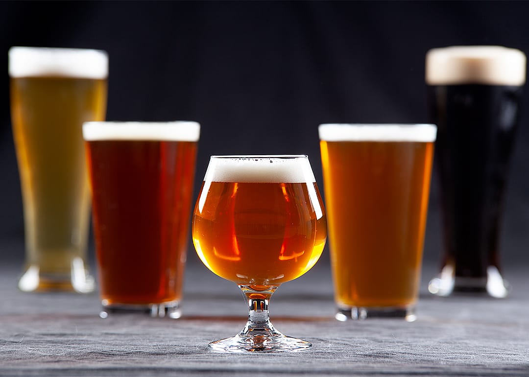 Five beer styles with Imperial IPA goblet style in foreground.