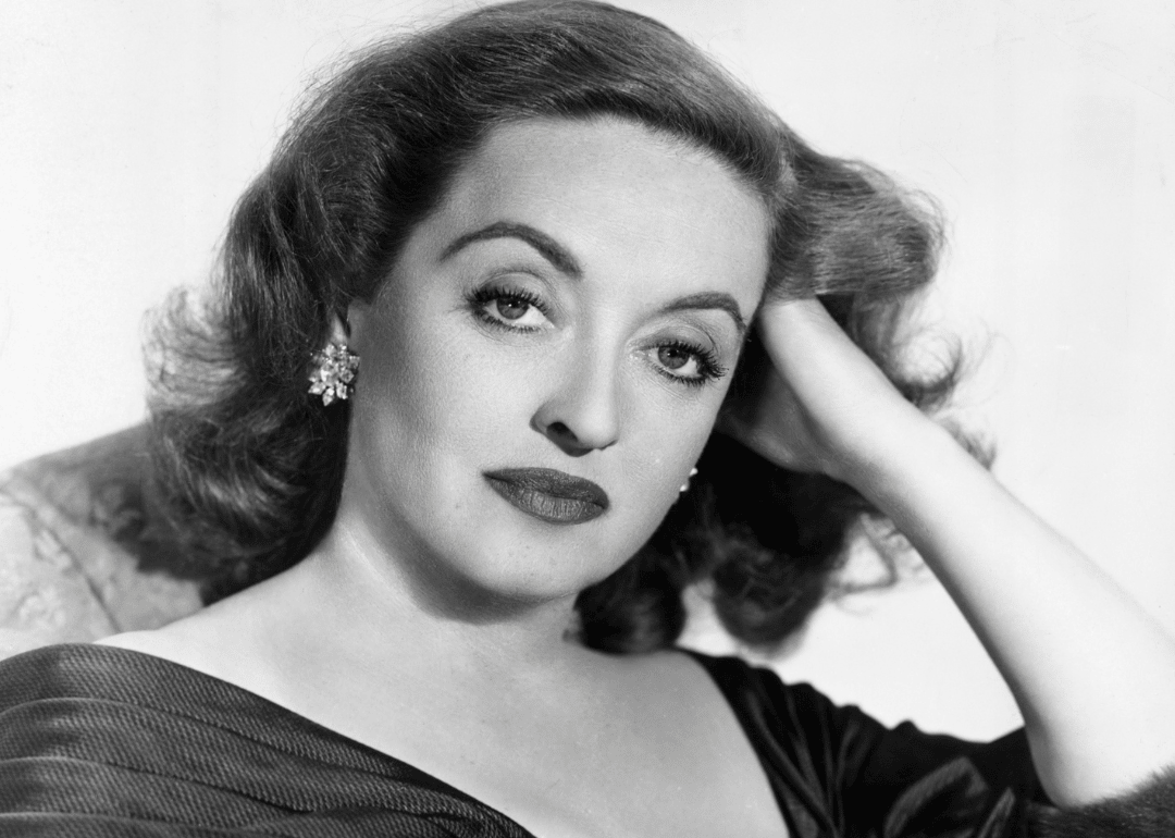Bette Davis poses in studio portrait.