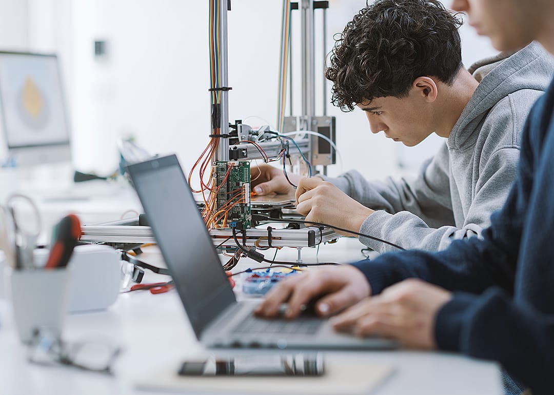 Students working on a technology project in the lab.