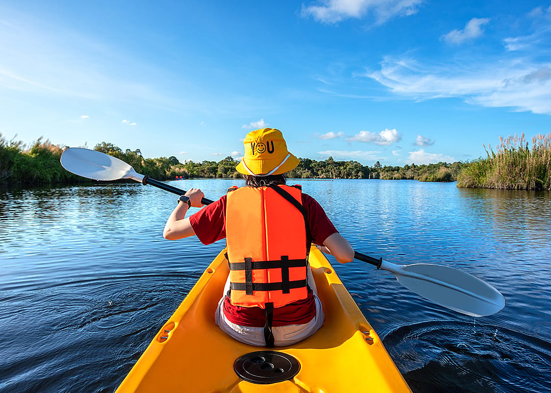 Kayaker on lake.