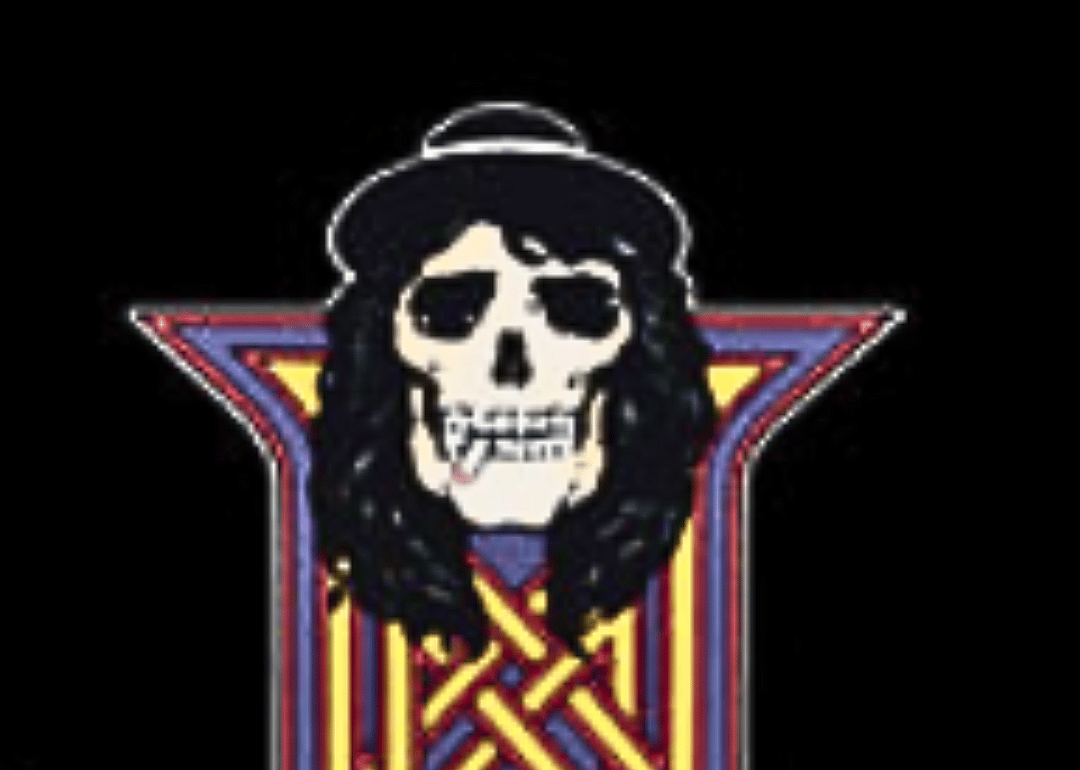 A skull in a wig and hat.