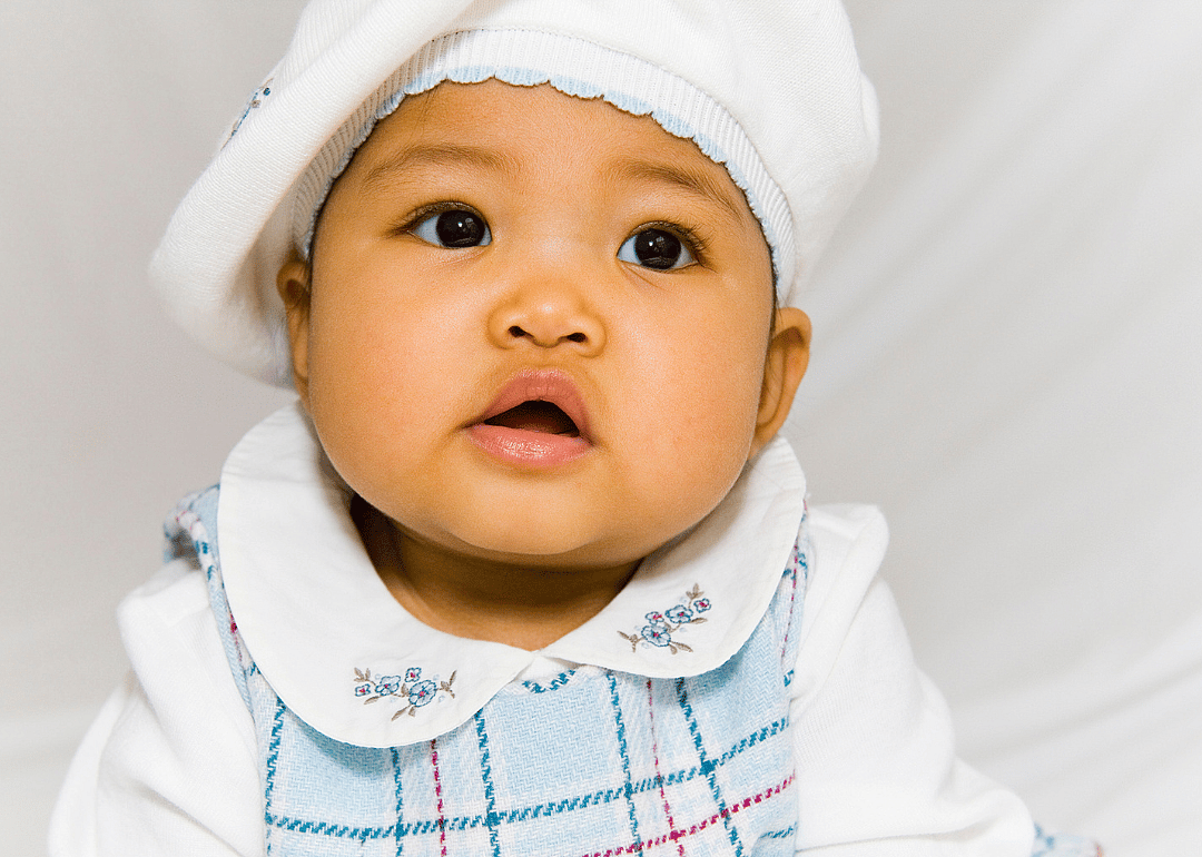 Asian girl in a white beret.