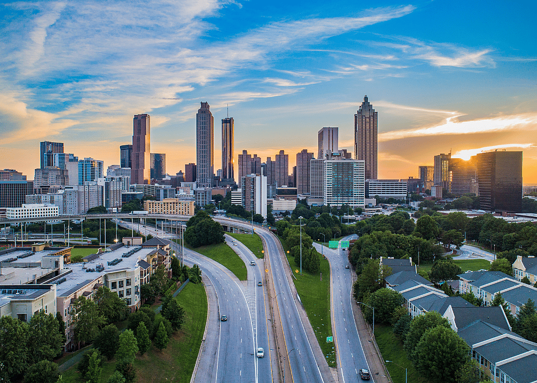 City skyline with roads leading to the city in the foreground.
