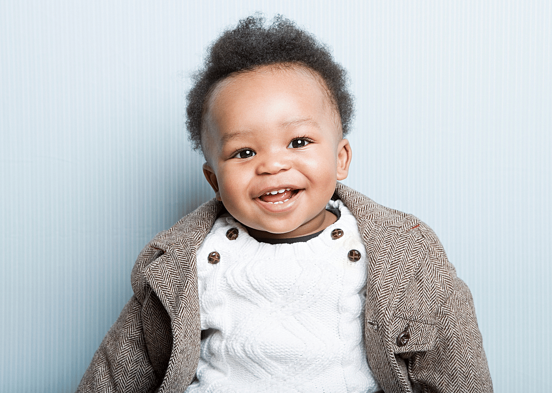 African American baby boy wearing a jacket.