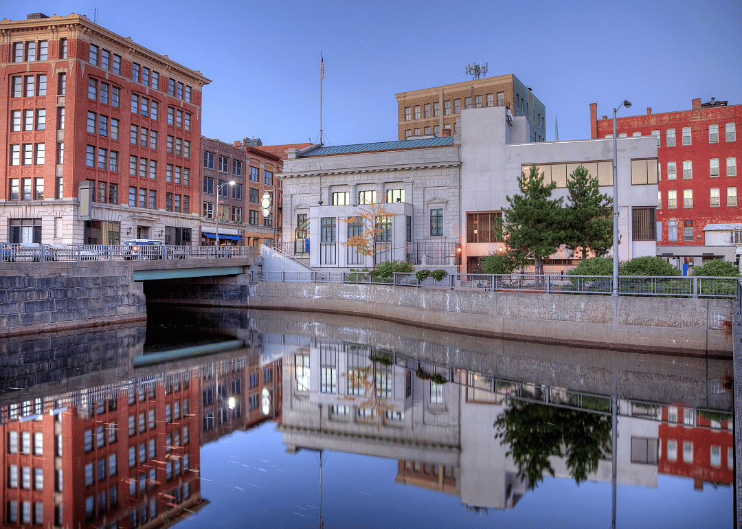 Tall brick buildings lining the banks of the river.
