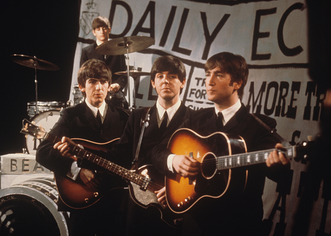 The Beatles prepare to perform on a TV set