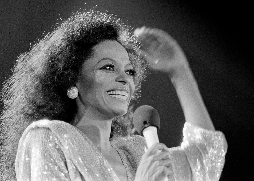 Diana Ross smiles onstage.