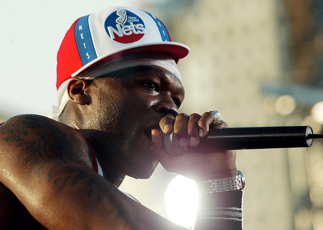 50 Cent performing onstage.