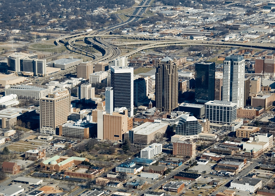 An aerial view of a city and highways leading to it.