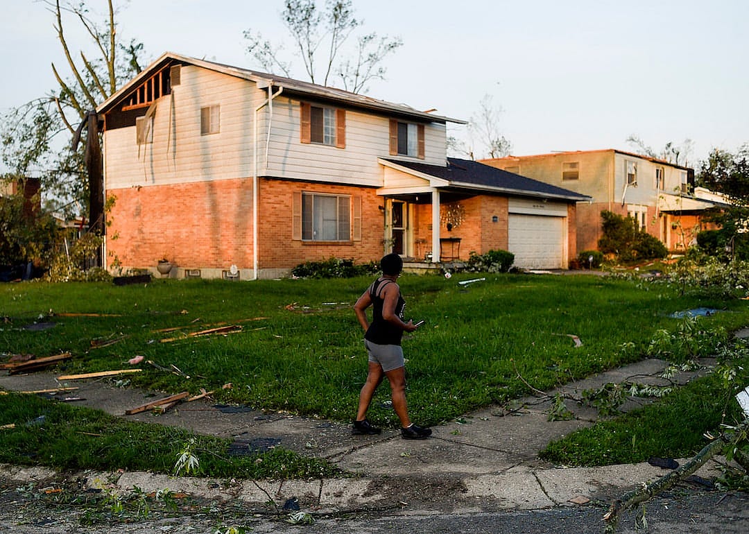 A resident inspects the damage to their home following powerful tornados on May 28, 2019, in Trotwood, Ohio.