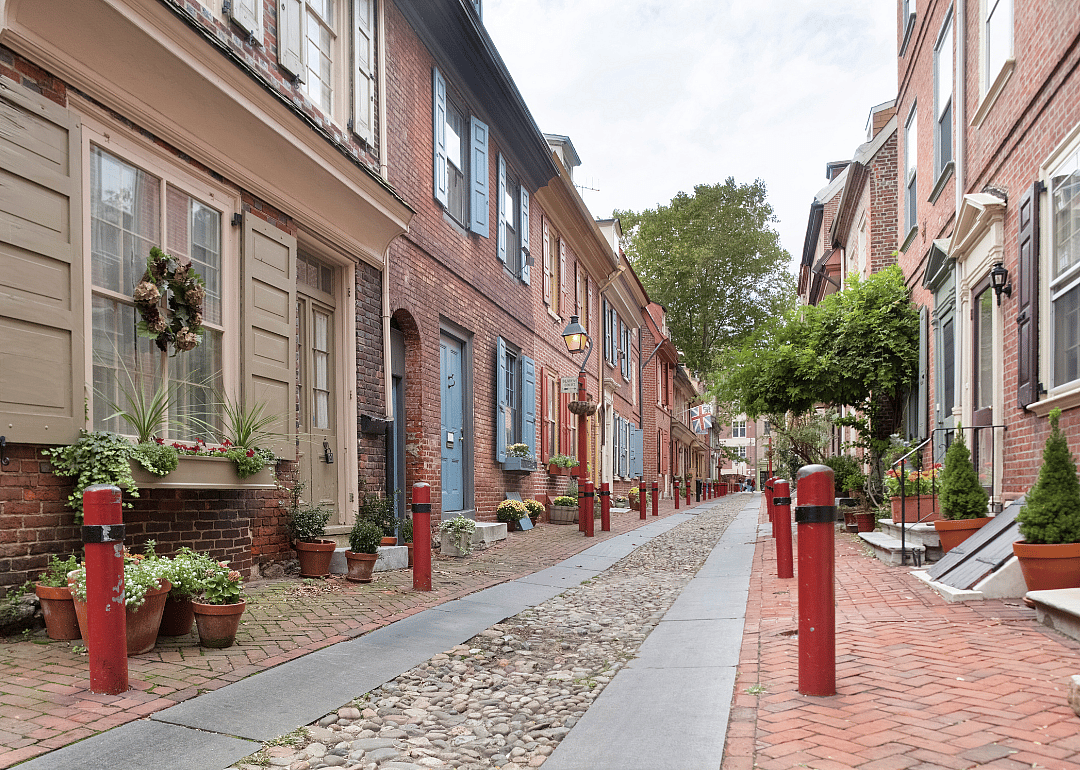 An alley between historic row homes.