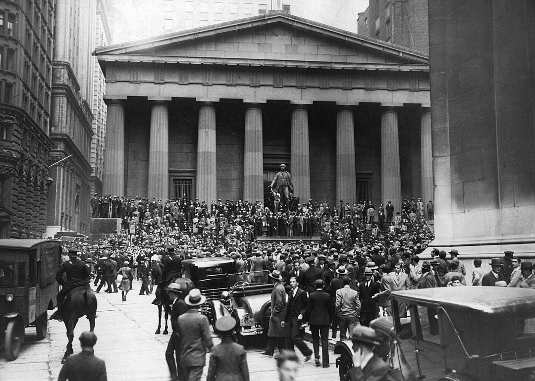 A large crowd of people gather outside the New York Stock Exchange after the market crashed in October 1929.