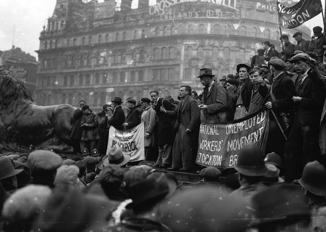 Unemployed workers in England gather to protest.