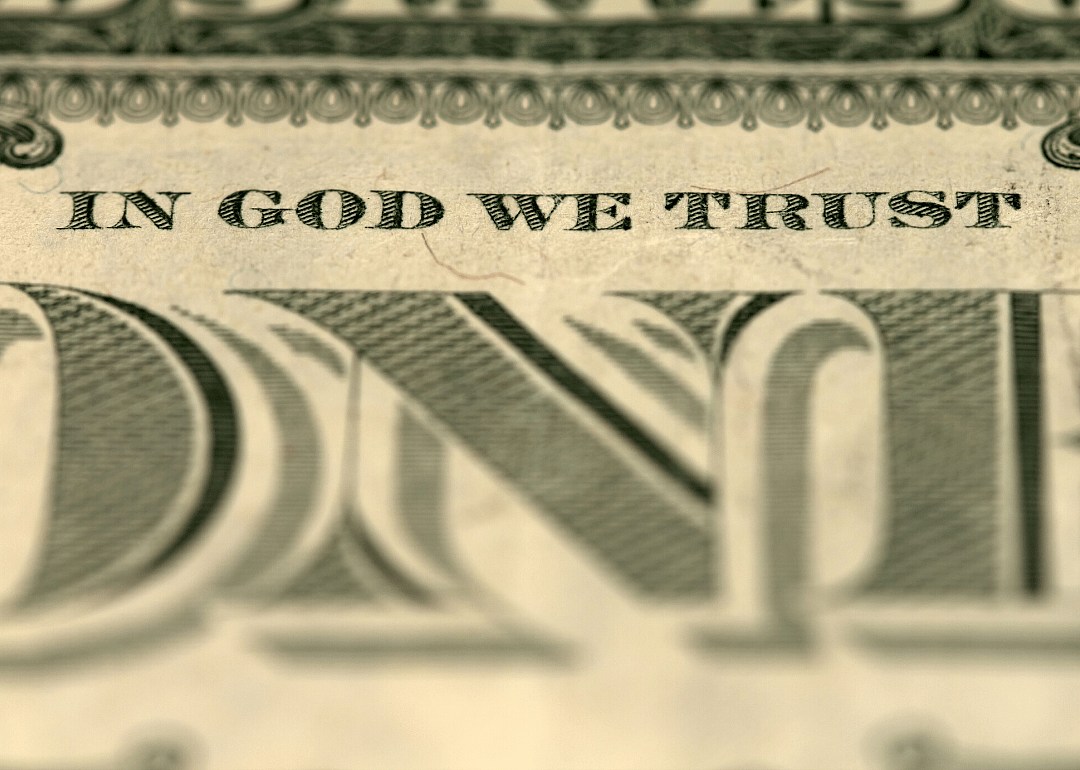 "In God We Trust' appears on the back of a one dollar bill.