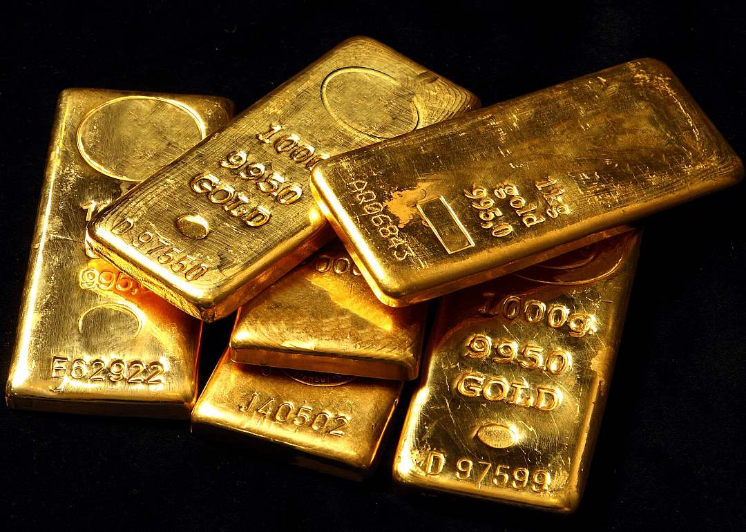 A small stack of shiny gold bullion bars.