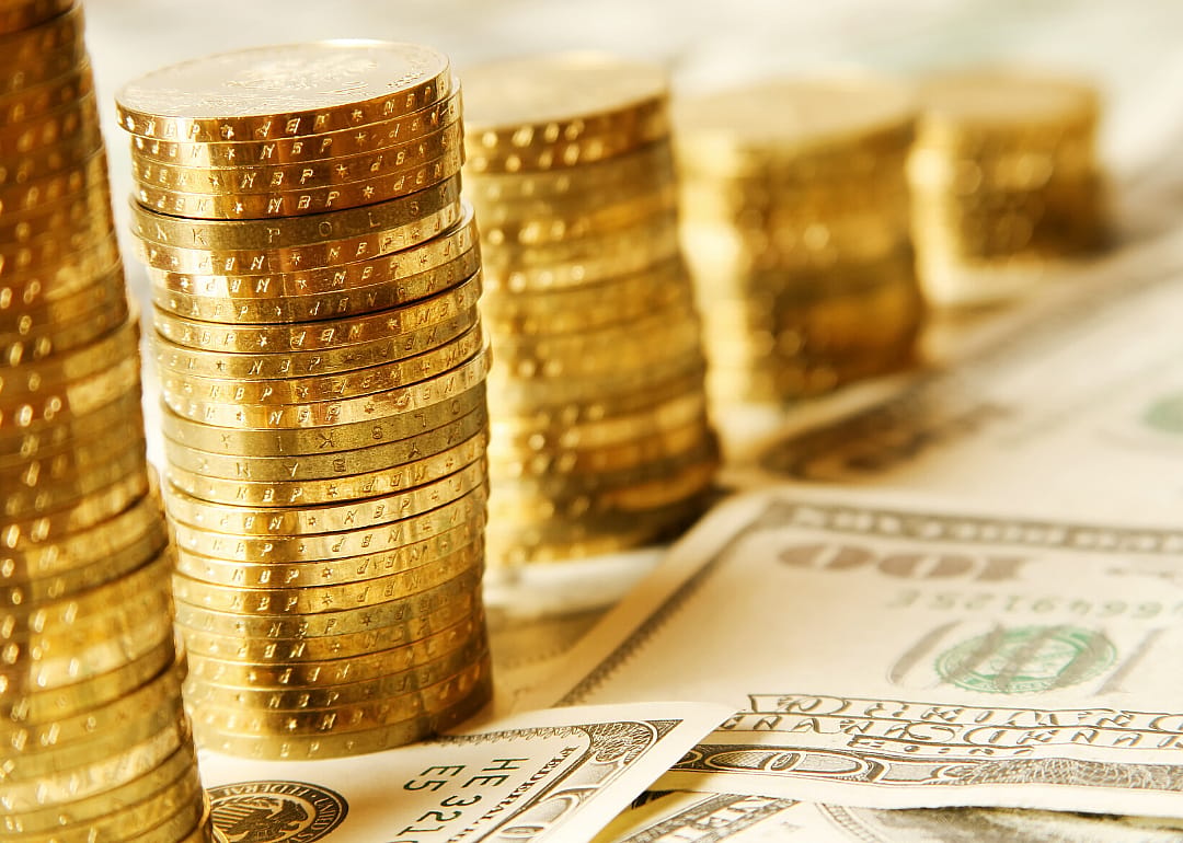Several stacks of shiny gold coins.