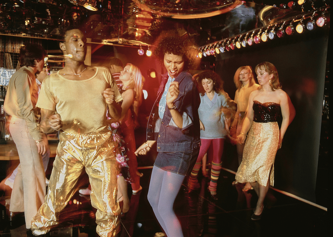 People dancing at discotheque.