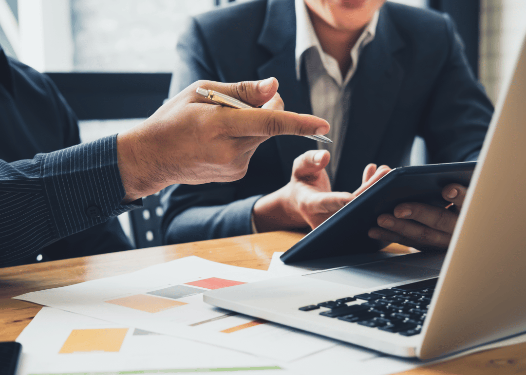 A business woman and a man  look at payment options online