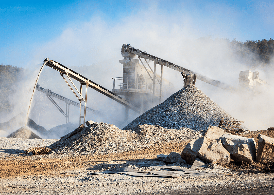 Machines moving stone at a quarry.