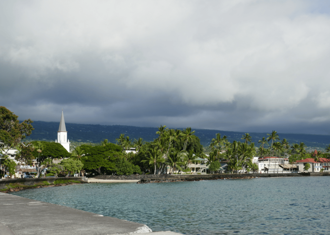 A view of Kailua Kona with storm clouds overhead.