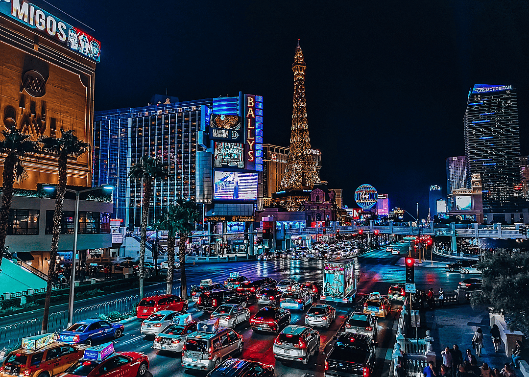 Colorful lights of Las Vegas city buildings and night traffic in the city.