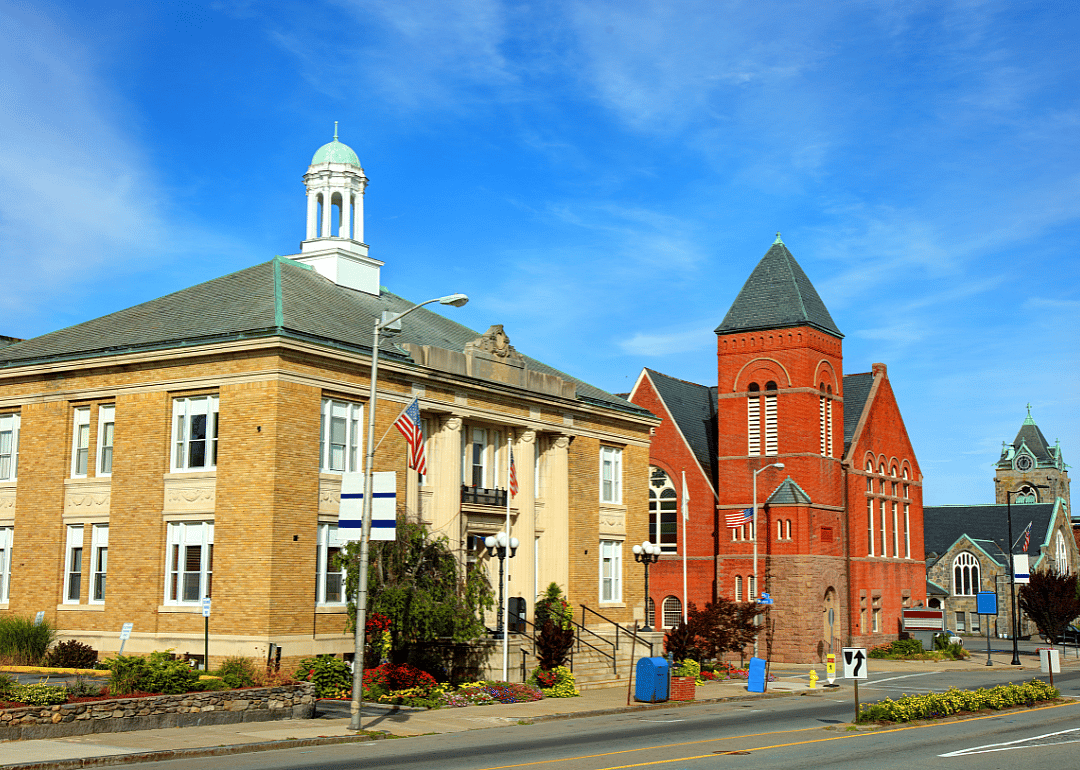 A few brick buildings along a city street.
