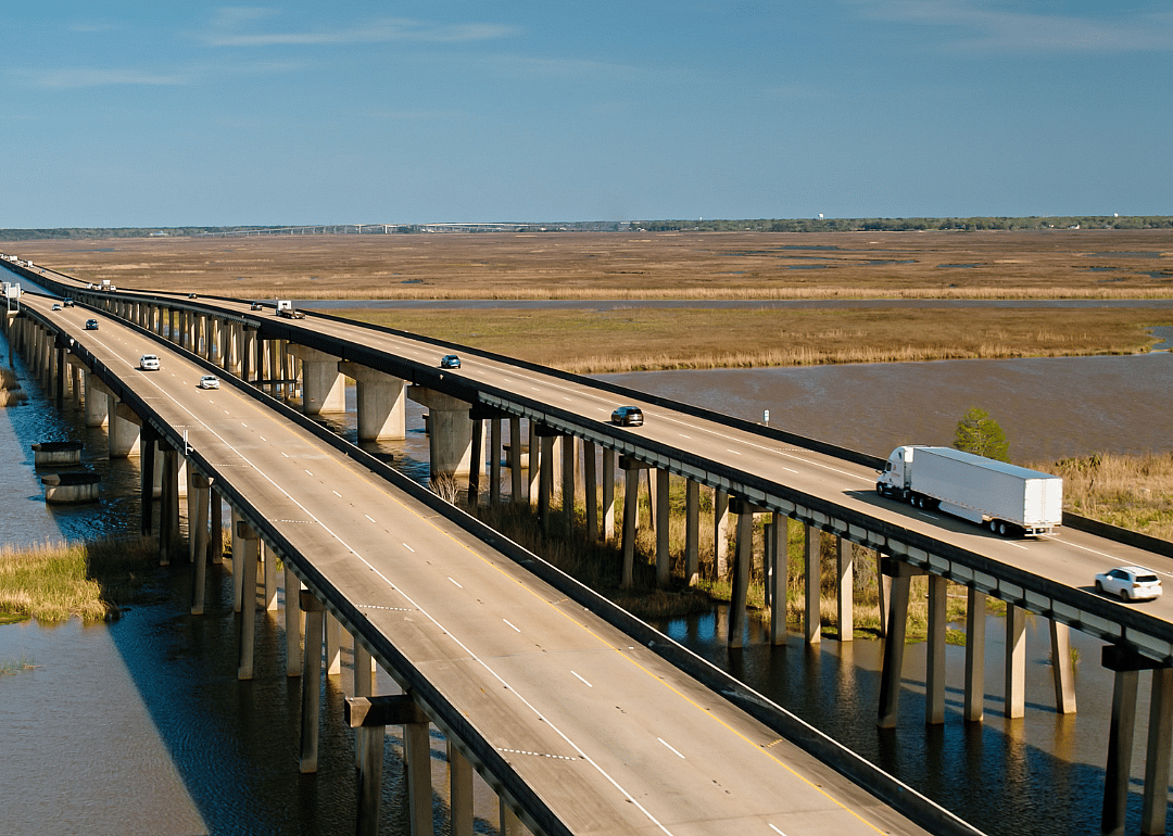 An high-angle view of cars driving on the interstate.