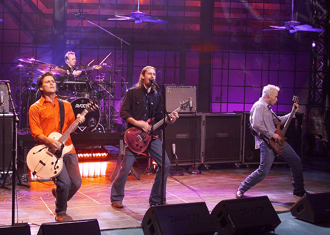 Nickleback performing onstage.