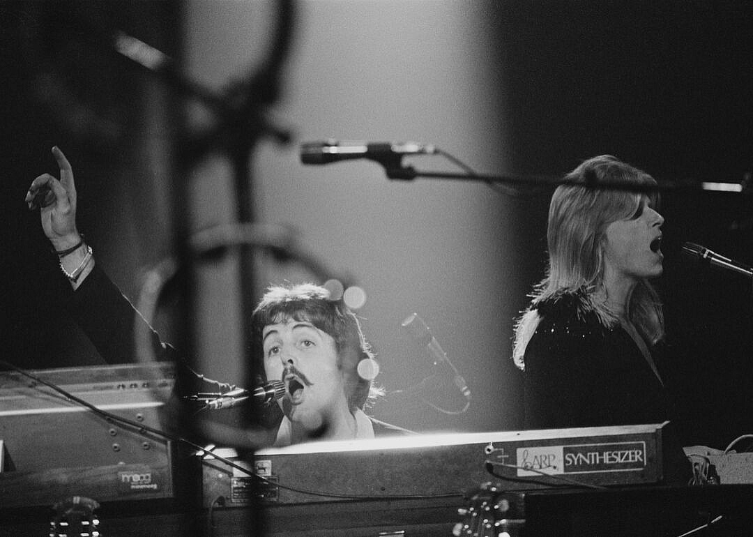 Paul McCartney performing onstage with Wings.