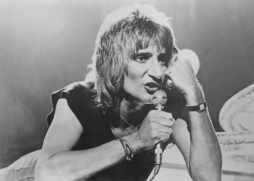 Rod Stewart performing onstage.