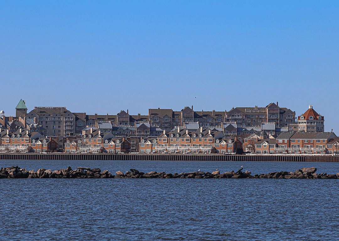 Rows of buildings by the body of water.