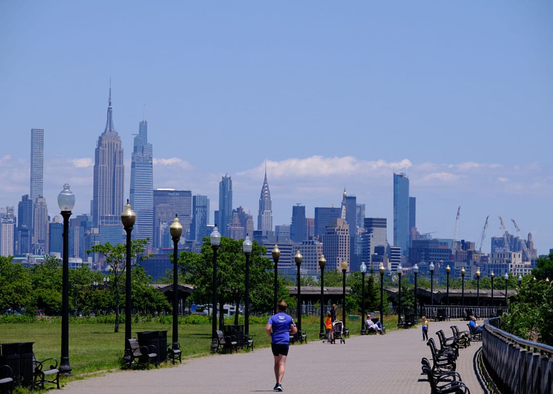 A man jogging at a park in Jersey City.