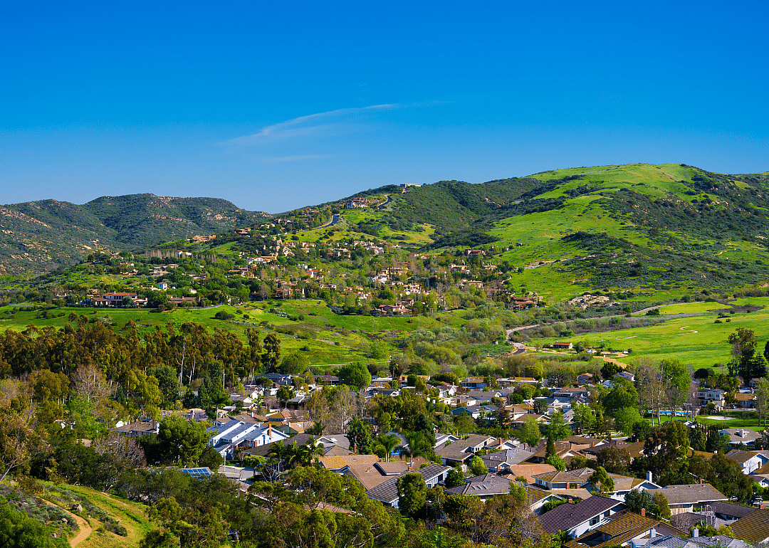 Homes going up the green hills.