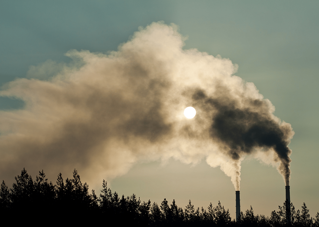 Smokestacks polluting the air.