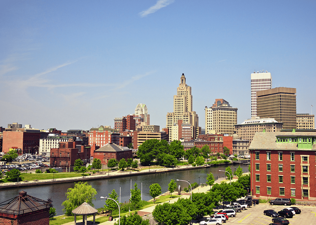 A city skyline with river in the foreground.