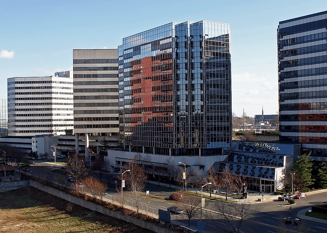 Modern downtown buildings along the road.