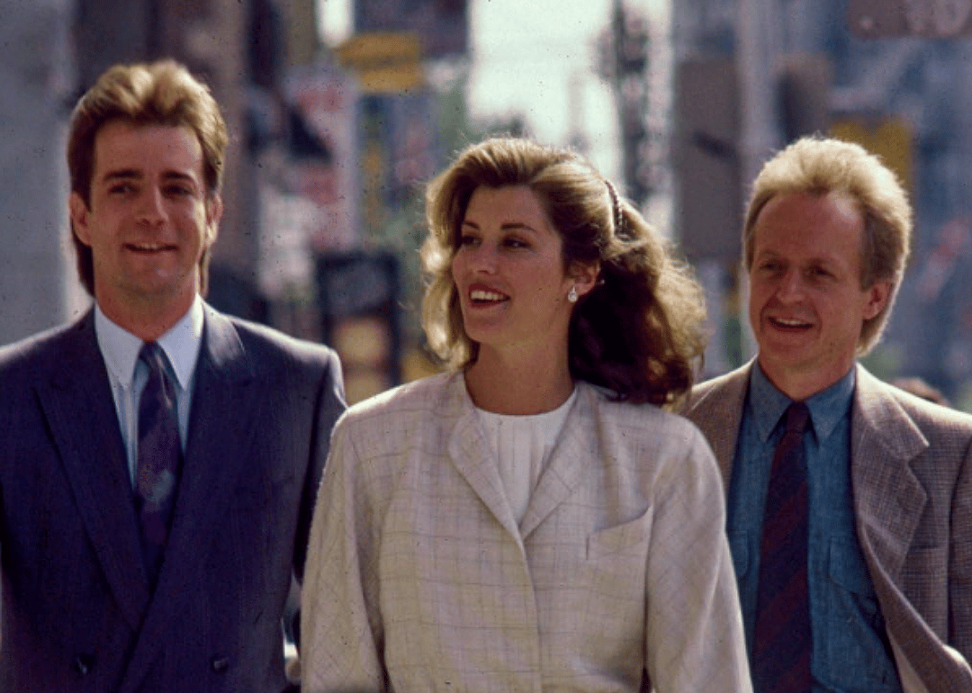 C. David Johnson, Sonja Smits and Eric Peterson walking down the street in a promotional image for Street Legal.