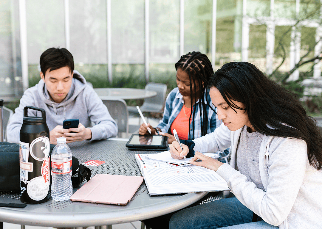 College students studying at a table.