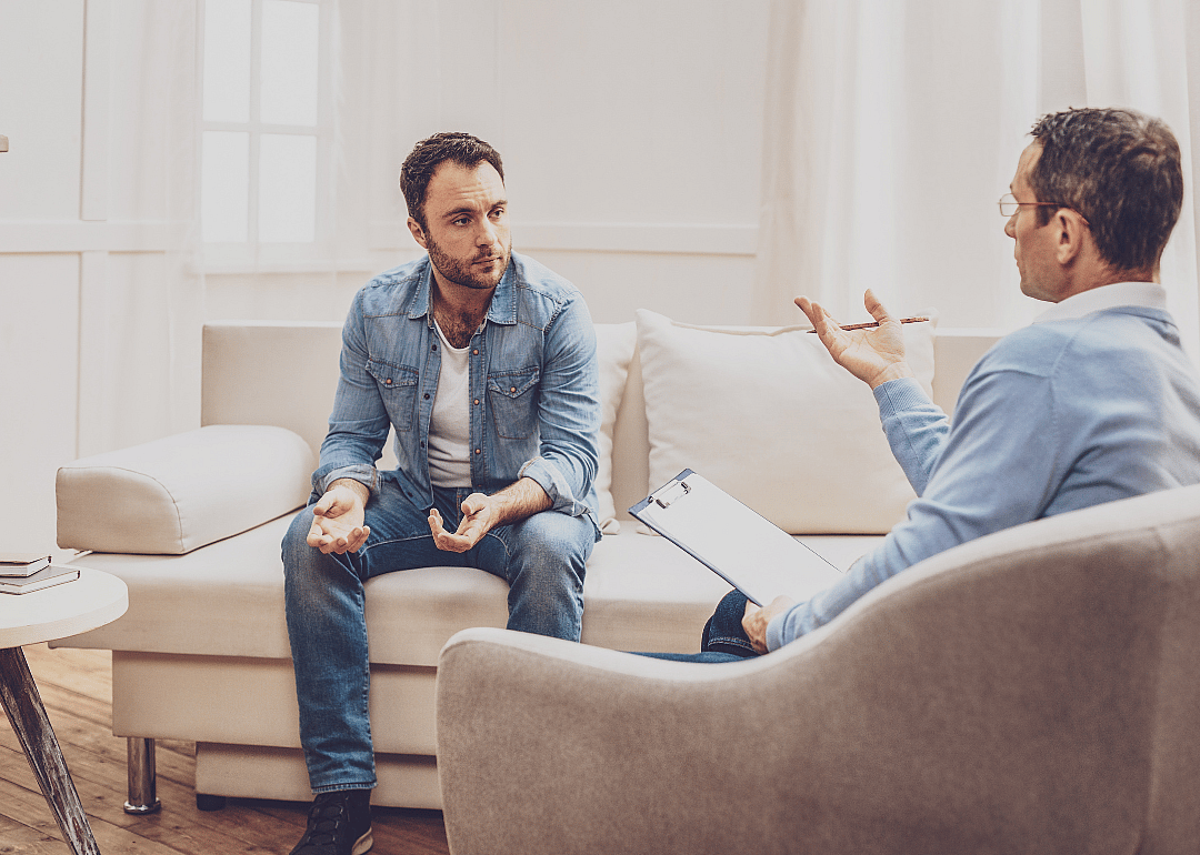 A psychologist and their patient talking during an appointment