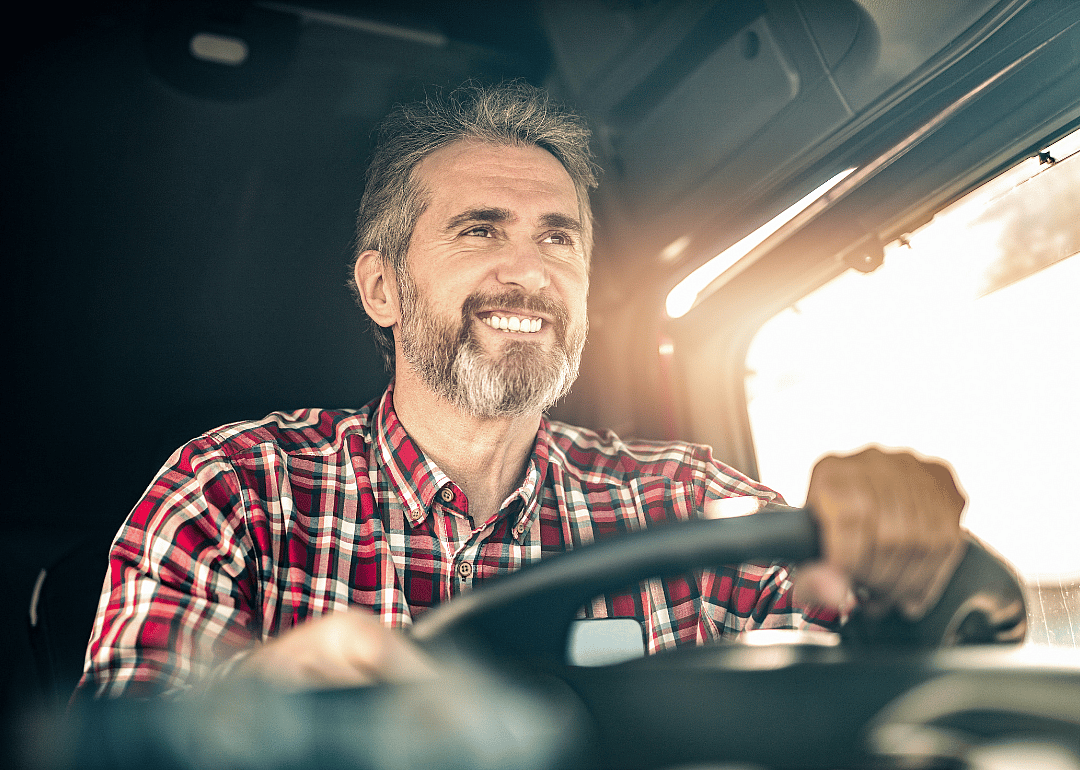A truck driver driving a truck.