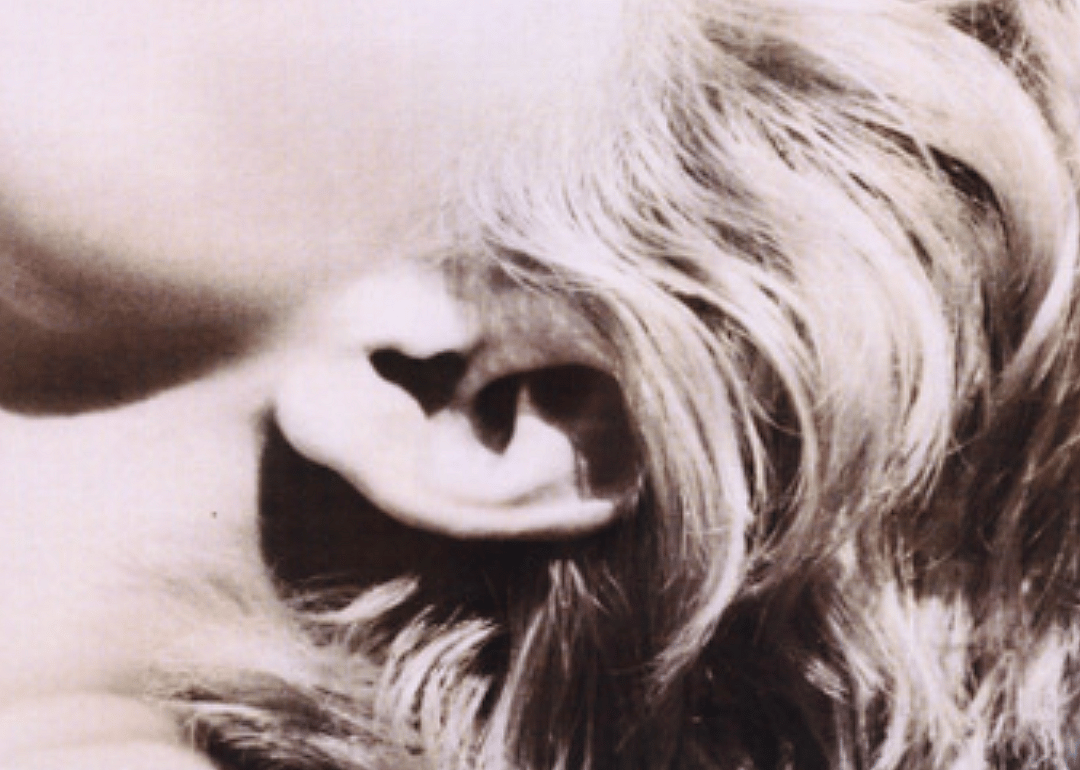 An ear with blonde Hair
