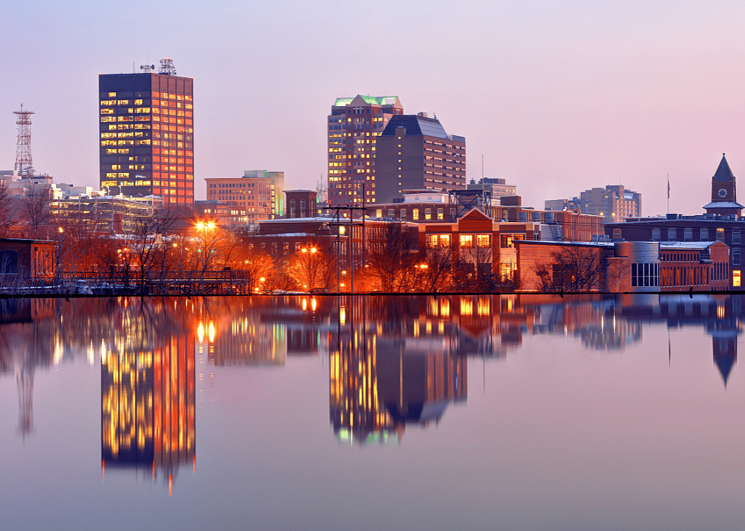 The skyline in downtown Manchester at dusk.