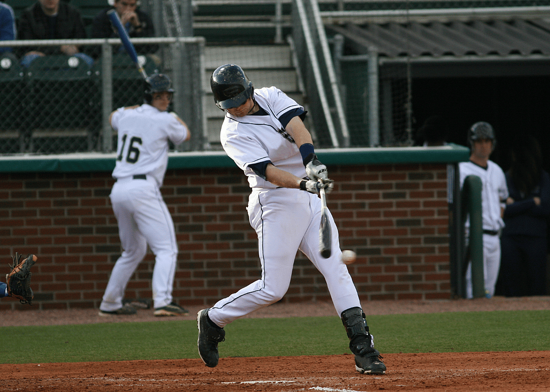Baseball player hits a ball