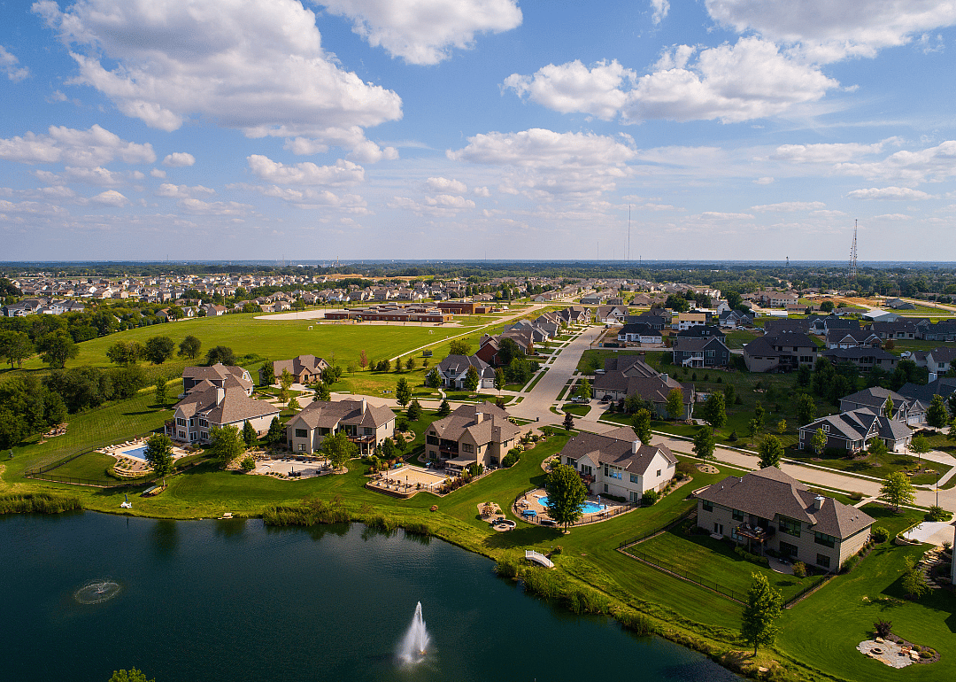 Aerial view of waterfront single-family homes in Bettendorf.
