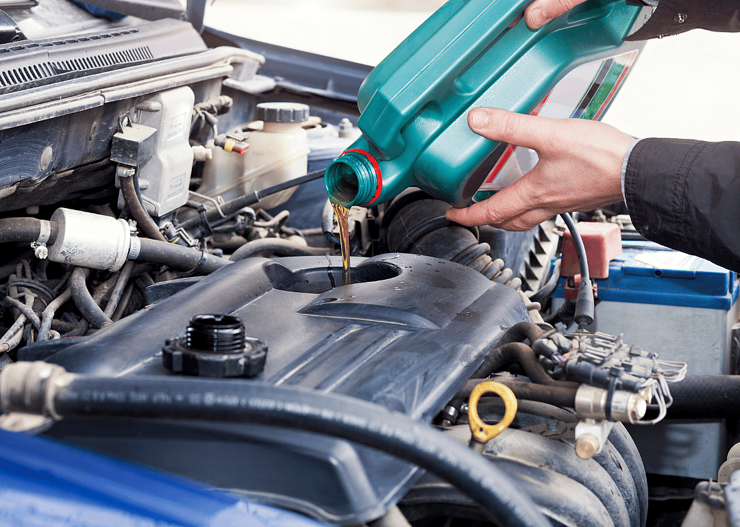 A car's motor receiving an oil change.