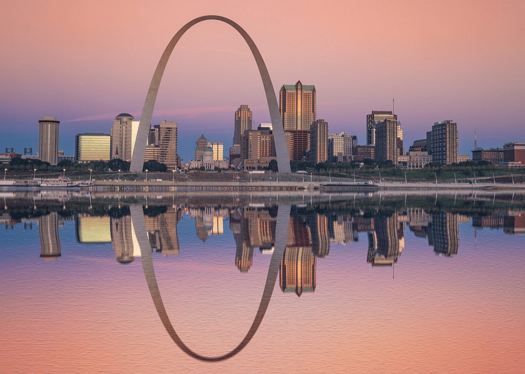 St. Louis and its iconic arch being reflected in water at sunrise.