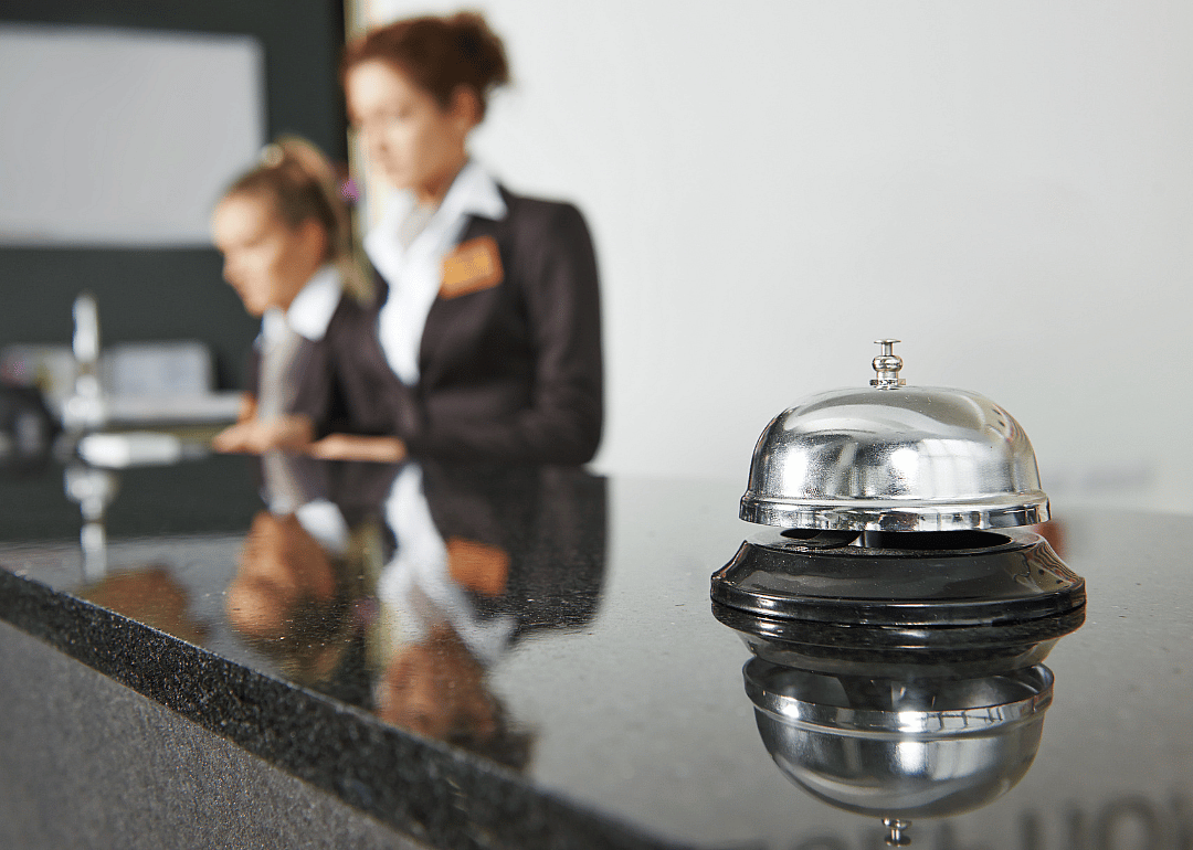 Two lobby attendants and a bell.